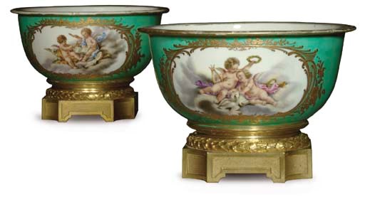 A PAIR OF ORMOLU-MOUNTED LATER DECORATED SEVRES PORCELAIN ICE PAIL LINERS