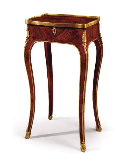 A LOUIS XV ORMOLU-MOUNTED KINGWOOD TABLE A OUVRAGE