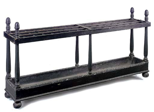 A BLACK JAPANNED STICK STAND