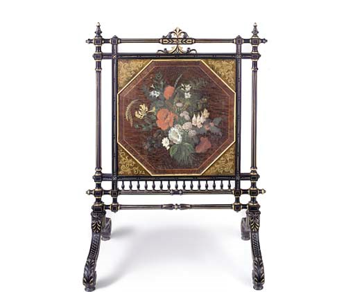 A LATE VICTORIAN EBONISED AND PARCEL GILT FIRE SCREEN