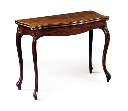 A GEORGE III MAHOGANY SERPENTINE GAMES TABLE