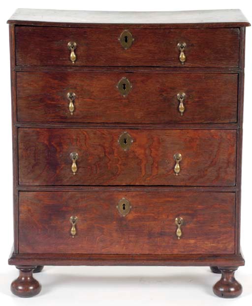AN ENGLISH PROVINCIAL OAK CHEST OF DRAWERS,