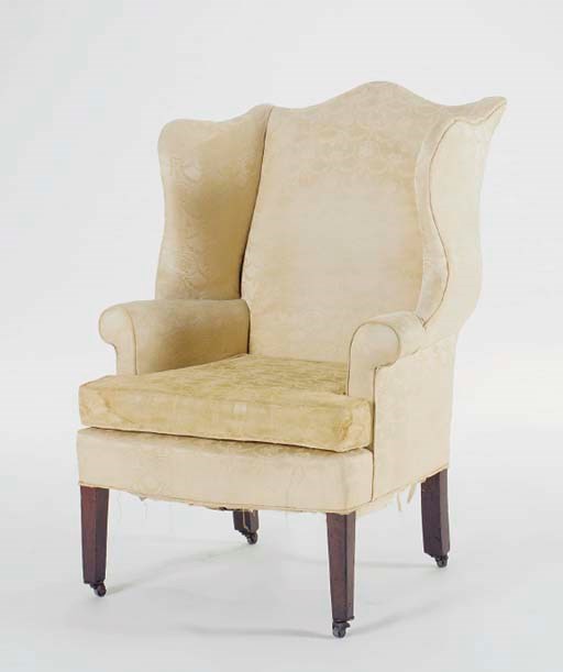 A YELLOW UPHOLSTERED MAHOGANY WINGBACK ARMCHAIR,