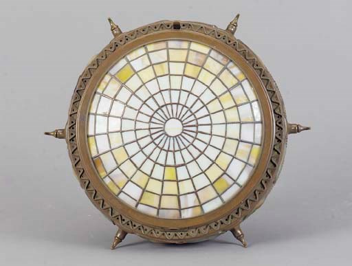 A PATINATED BRONZE AND LEADED GLASS CEILING FIXTURE,