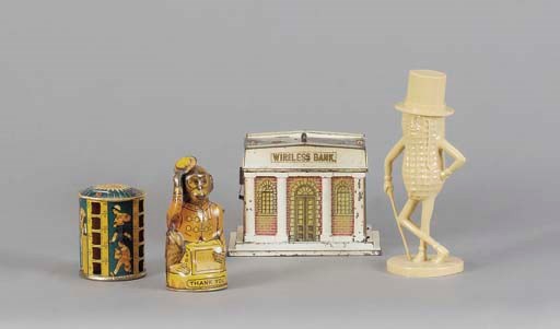 A GROUP OF SEVEN VINTAGE MONEY BANKS,