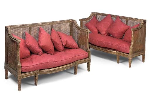 A PAIR OF GILTWOOD AND CANED SOFAS