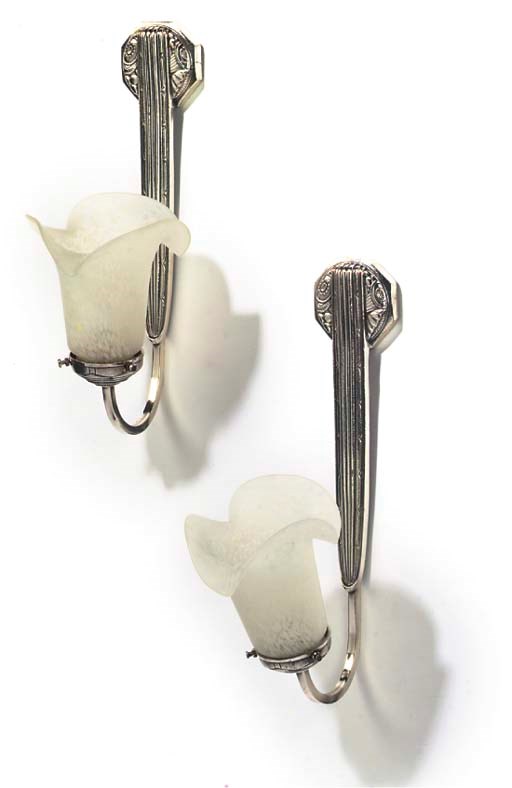 A SET OF FOUR SILVERED BRASS ART DECO WALL LIGHTS