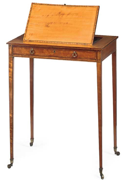 A GEORGE III SATINWOOD AND CROSSBANDED READING TABLE