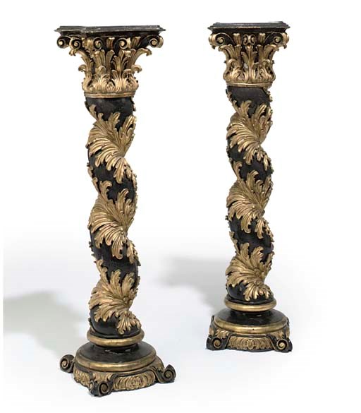 A PAIR OF EBONISED AND GILT RESIN SOLOMONIC COLUMNS