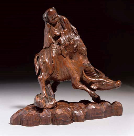 A Chinese rootwood carving of a boy and buffalo, 18th Century or later