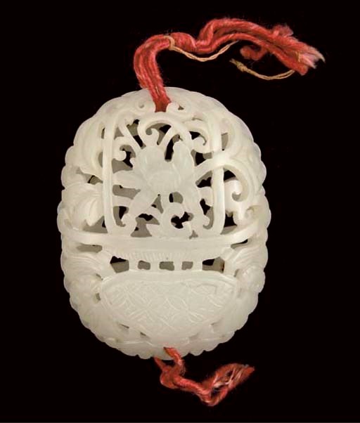 A Chinese celadon jade twin sectioned pendant, 19th Century