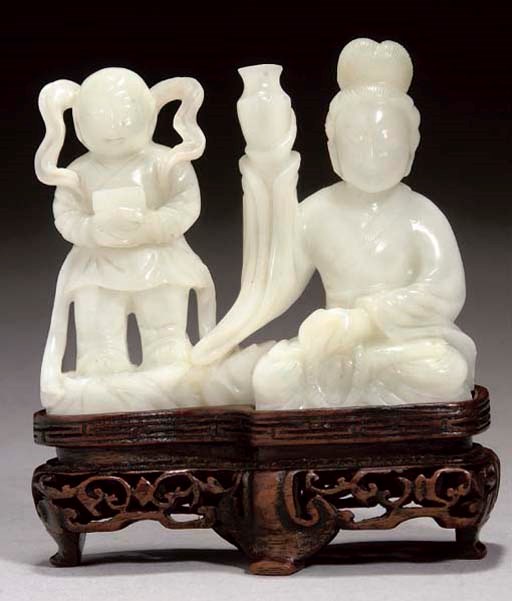 A Chinese pale celadon carving of a a lady and child attendant, 20th Century