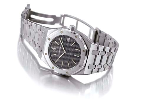 Audemars Piguet. A large stainless steel limited edition self-winding water-resistant wristwatch with date, bracelet and glazed back