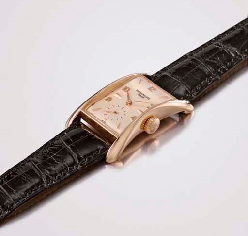 Patek Philippe. A very fine and rare 18K pink gold rectangular-shaped wristwatch with flared sides
