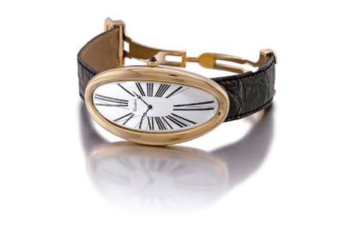 Cartier. A very fine and unusual 18K gold oversized oval curved wristwatch
