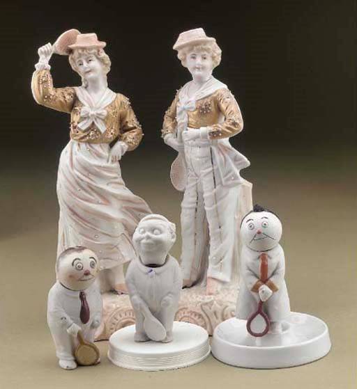 A PAIR OF BISQUE TENNIS FIGURES