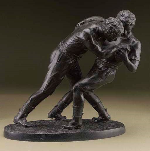 A BRONZE GROUP OF TWO RUGBY PLAYERS