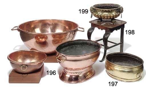 AN OVAL BRASS JARDINIERE