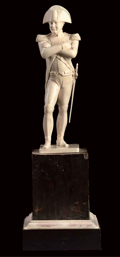 A FRENCH CARVED IVORY STATUETTE OF NAPOLEON BONAPARTE