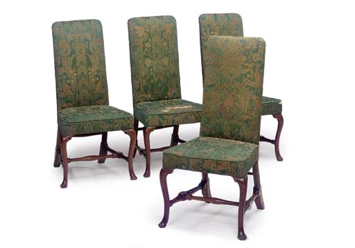 A SET OF FOUR GEORGE I PROVINCIAL WALNUT AND UPHOLSTERED CHAIRS