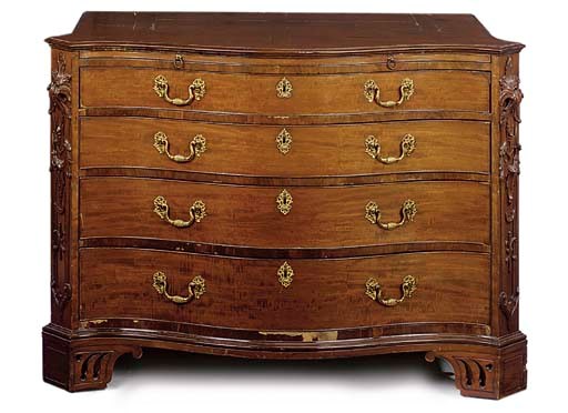 A MAHOGANY SERPENTINE CHEST