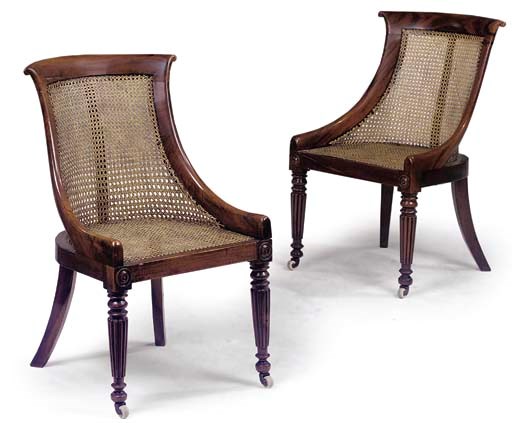 A MATCHED PAIR OF REGENCY GONCALO ALVEZ AND CANED LIBRARY CHAIRS