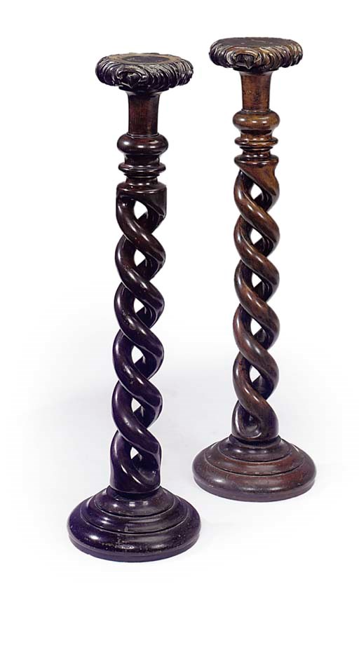 A PAIR OF HARDWOOD SPIRAL CARVED TORCHERES