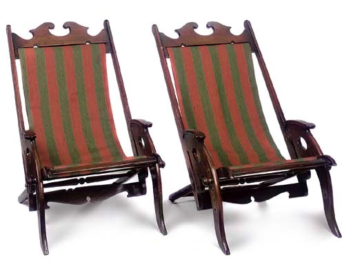 A PAIR OF TEAK FOLDING CAMPAIGN CHAIRS