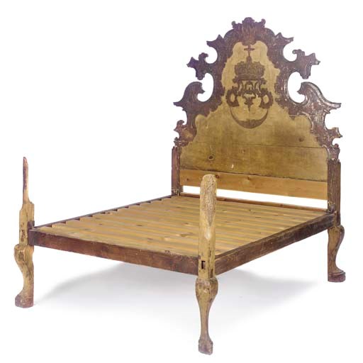 A NORTH ITALIAN OCHRE PAINTED AND GILT-VARNISHED 'MECCA' DECORATED BED