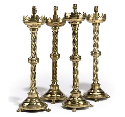 A SET OF FOUR BRASS TABLE LAMPS