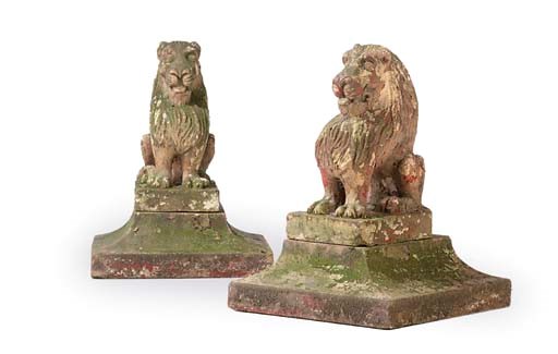 A PAIR OF VICTORIAN PAINTED STONEWARE MODELS OF LIONS
