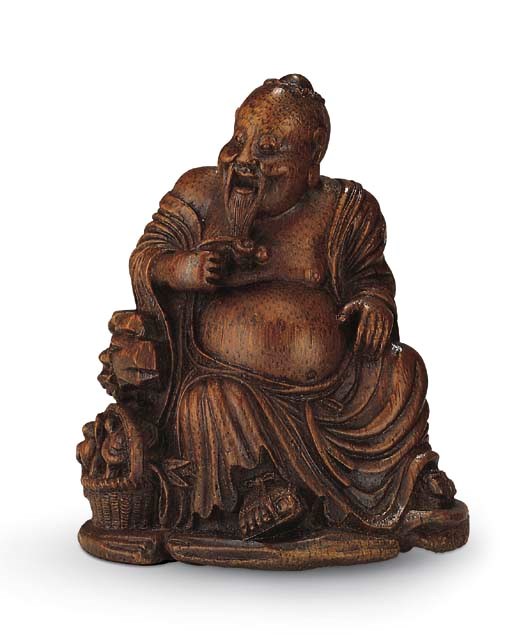 A FINELY CARVED BAMBOO FIGURE