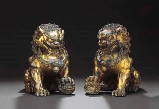 A PAIR OF LARGE GILT-BRONZE FIGURES OF BUDDHIST LIONS