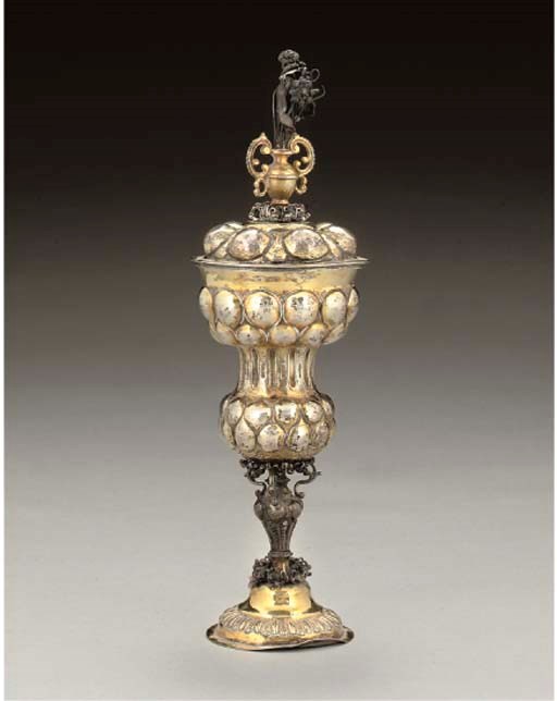 A 17TH CENTURY GERMAN PARCEL-GILT PINEAPPLE CUP & COVER,