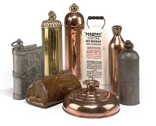 A COLLECTION OF BRASS COPPER POTTERY AND CERAMIC WARMERS