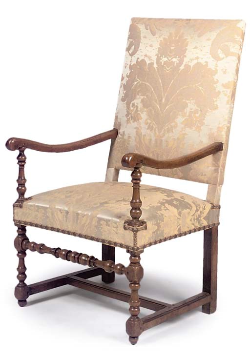 A FRENCH WALNUT ARMCHAIR