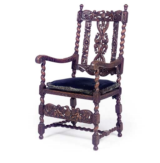 A CARVED BEECH ARMCHAIR