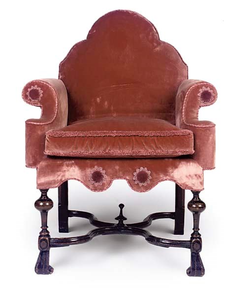 A STAINED BEECH AND VELVET UPHOLSTERED EASY ARMCHAIR