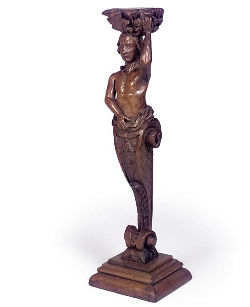 A FLEMISH CARVED OAK CARYATID TORCHERE