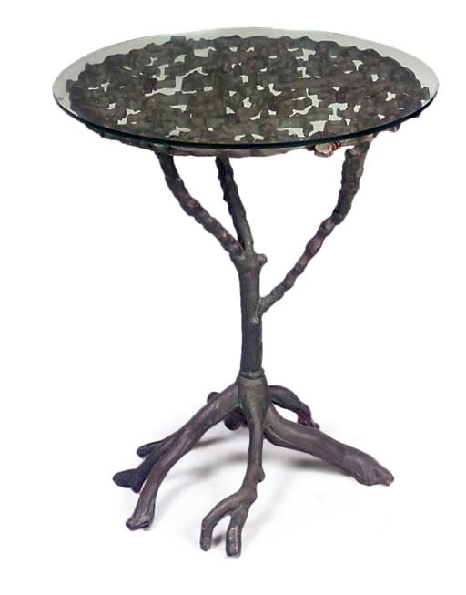 A CAST IRON AND POLYCHROME DECORATED OCCASIONAL TABLE