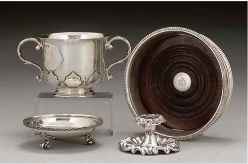 A GEORGE III SILVER WINE COASTER