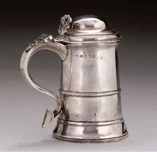 A GEORGE III SILVER TANKARD