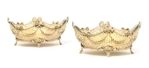 A PAIR OF CONTINENTAL SILVER-GILT BASKETS