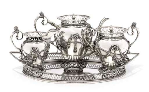A THREE-PIECE DUTCH SILVER TEA-SERVICE AND AN ASSOCIATED TRAY