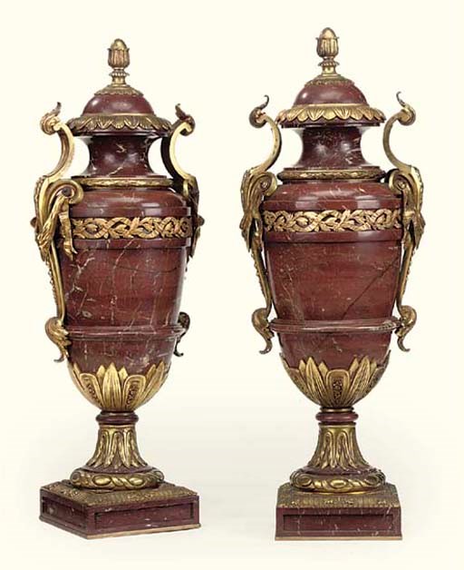 A PAIR OF FRENCH GILT-BRONZE MOUNTED RED MARBLE URNS