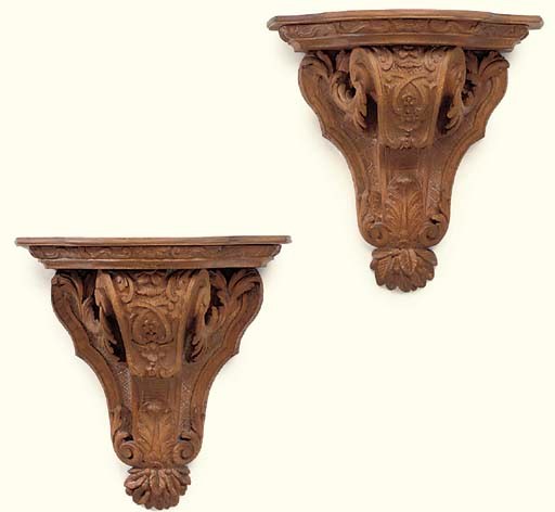 A PAIR OF FRENCH OAK WALL BRACKETS