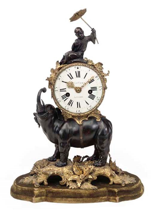 A LOUIS XV ORMOLU AND BRONZE MANTEL CLOCK