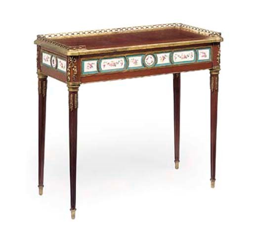 A LOUIS XVI ORMOLU AND PORCELAIN-MOUNTED MAHOGANY TABLE A ECRIRE