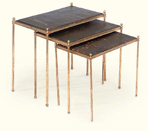 A NEST OF THREE GILT-BRASS AND GREEN-LEATHER LINED TABLES