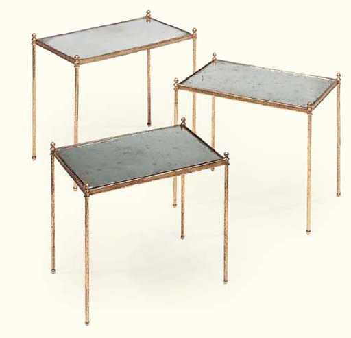 A NEST OF THREE GILT BRASS AND GLASS TABLES